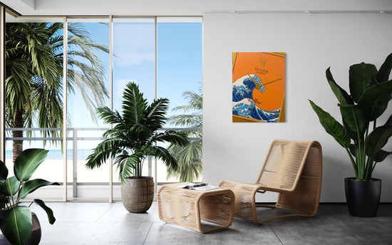 A white room with a wicker chair in front of a window overlooking the ocean
